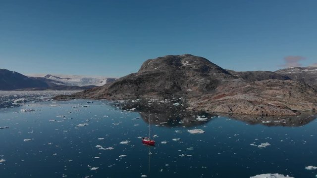 Aerial View of Sailboat on Icebergs in Johan Petersen Fjord East Greenland