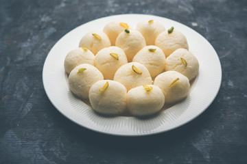 Indian Rasgulla or Rosogulla dessert/sweet served in a bowl. selective focus