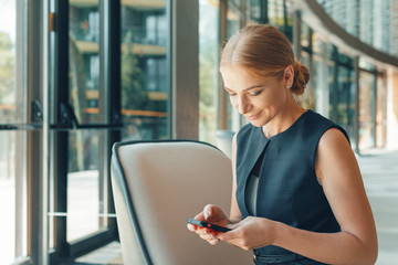 woman using mobile phone in the office