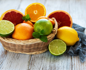 Naklejka na ściany i meble Basket with citrus fresh fruits