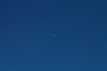 Airplane on a blue sky. Selective focus