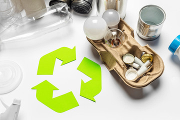 Eco concept with recycling symbol on table background top view