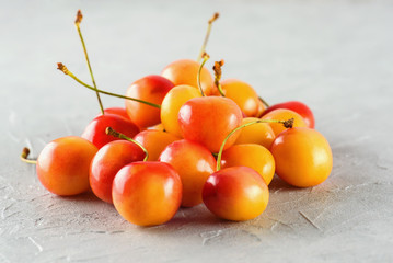 Ripe yellow-red cherry berries macro close-up.  Juicy berries, diet, healthy lifestyle.
