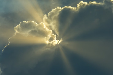 Sun light rays through clouds