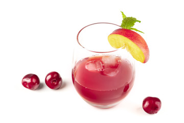 A vibrant red drink with cherries on white