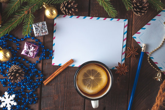Christmas decorations, balls, anisee tree, cinnamon, cones, spruce branch, gifts on a wooden background. Christmas and New Year holidays. Copy space. Top view. Christmas flat lay and background
