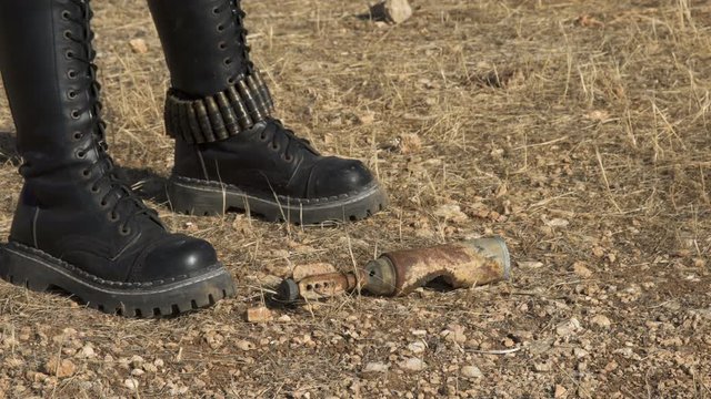 Exploded Artillery Mortar shell mine found by sapper biker woman Demining (Bomb disposal) mortar bomb.