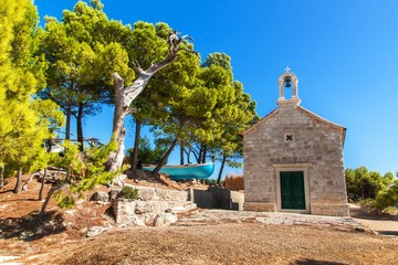 Old stone church in Croatia on the island of Hvar. Hot day at the Adriatic Sea. Christian church....