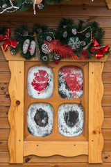 Small wooden window with Christmas decorations. Winter holidays concept