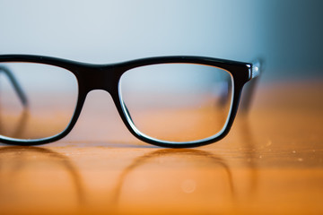 Eyeglasses on wooden table