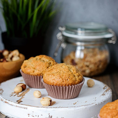 Homemade muffins, hazel nuts around