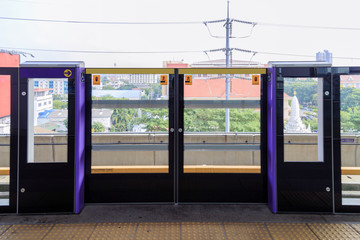 Slide door for safety passenger at sky train station.