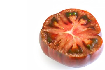 Fresh Black Russian Tomato Cut In Half On White Background