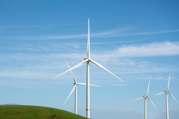 Wind turbines Blue sky and green hill in Esbjerg Denmark