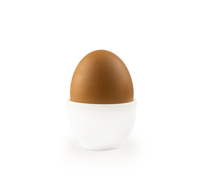 Boiled egg isolated on white background. Boiled Egg in Eggcup. Close-up of an egg isolated on white background. Single brown chicken egg isolated on white.