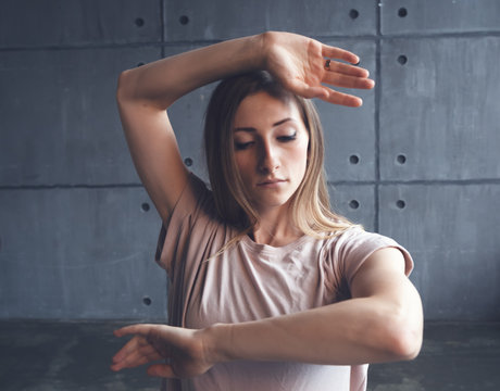 Young Beautiful Woman Professional Dancer Dancing During A Rehearsal In A Dance Studio, Modern Dramatic Style, Experimental Dance