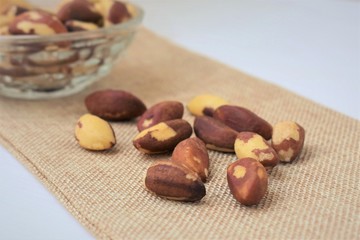 Brazil nuts, on a sackcloth, closeup.