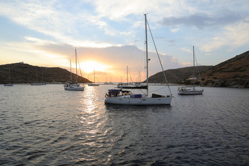 Fototapeta na wymiar Beautiful evening and sailboats in Kolona double bay Kythnos island Cyclades Greece.