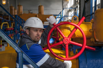 The mechanic - the repairman , operator production gas, Oil, gas industry. gas conditioning equipment and valve armature