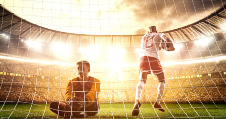 Intense soccer moment in front of the goal on the professional soccer stadium.