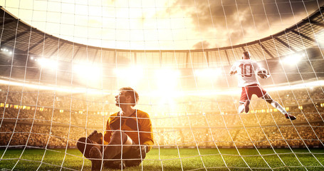 Intense soccer moment in front of the goal on the professional soccer stadium.