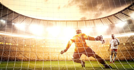 Intense soccer moment in front of the goal on the professional soccer stadium.