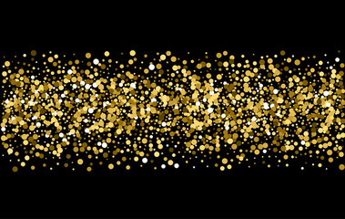 Gold sparkles on black background. Gold glitter .