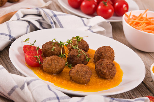 Meatballs with mashed carrots. 