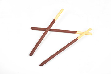 Biscuit sticks in chocolate coating on white background. Chocolate, cookies, biscuits coated bar.