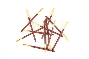 Fototapeta na wymiar Biscuit sticks in chocolate coating on white background. Chocolate, cookies, biscuits coated bar.
