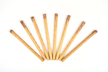 biscuit sticks with sweet filling on white background.