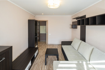 Interior of the flat. Warm tones, wooden floor. 