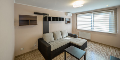 Interior of the flat. Warm tones, wooden floor. 