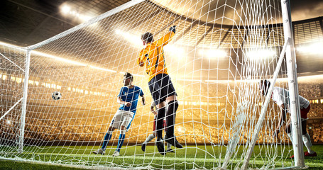 Intense soccer moment in front of the goal on the professional soccer stadium.