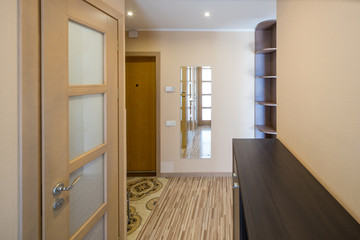 Interior of the flat. Warm tones, wooden floor. 