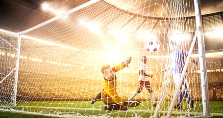 Intense soccer moment in front of the goal on the professional soccer stadium.