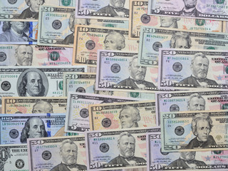 Background from different banknotes of dollars