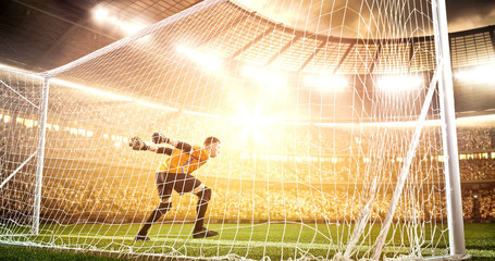 Intense soccer moment in front of the goal on the professional soccer stadium.