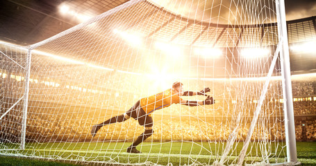 Intense soccer moment in front of the goal on the professional soccer stadium.