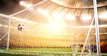 Intense soccer moment in front of the goal on the professional soccer stadium.