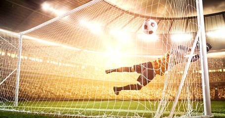 Intense soccer moment in front of the goal on the professional soccer stadium.