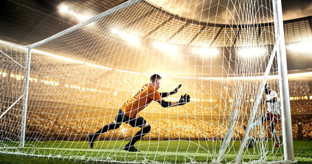 Intense soccer moment in front of the goal on the professional soccer stadium.