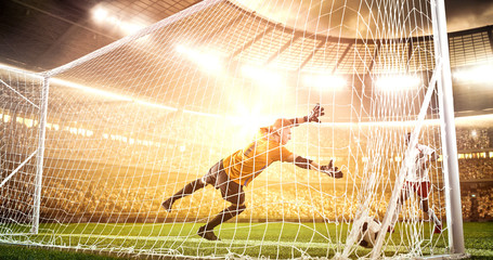 Intense soccer moment in front of the goal on the professional soccer stadium.