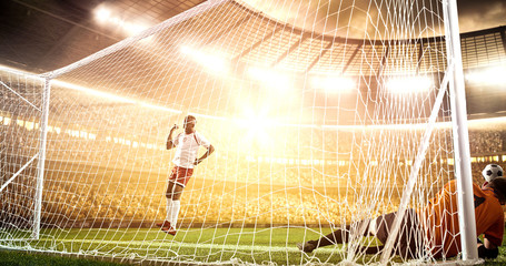 Intense soccer moment in front of the goal on the professional soccer stadium.