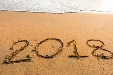 abstract  2018 on a beach sand