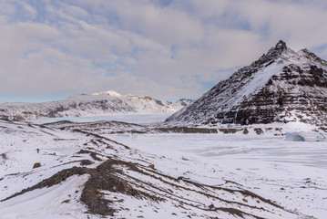 Vast landscape of Mountains, Glacier and glacial moraine,  in winters morning light,...