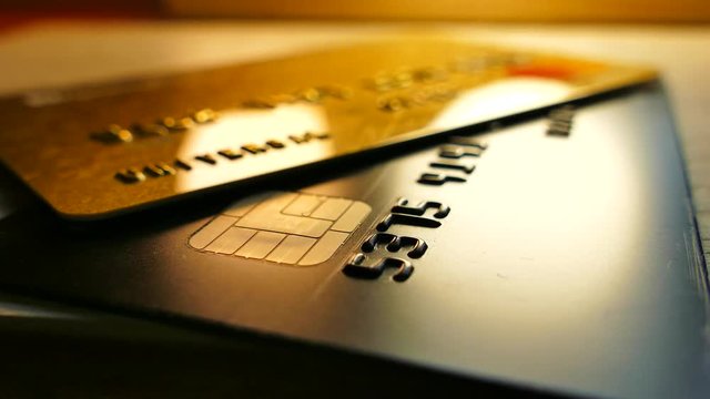 Money in bank accounts. Credit bank cards are on the table. Cashless payments.