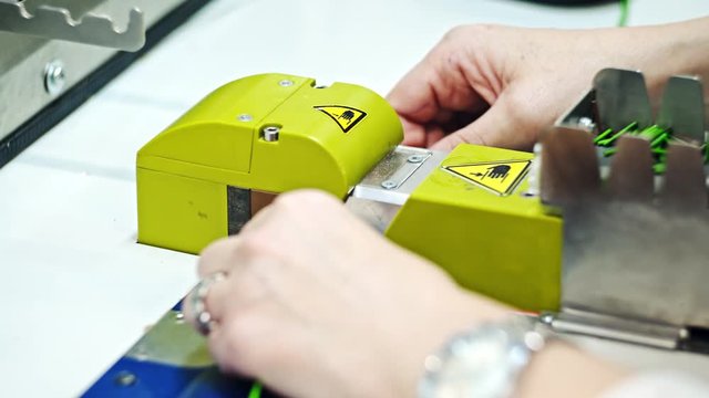 Female worker splicing and checking components