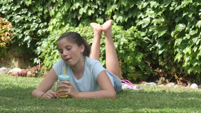 portrait of a teenager lying in the grass
