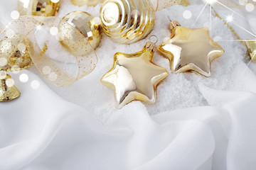 Fototapeta na wymiar gold christmas ornaments on white background